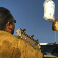  | Rosebud Sioux firefighter Chance Wooden Knife throws a bag of ice to firefighter Smokey Kills Smart at camp as their crew gets ready to head out on the Spring Creek Fire in 2018 in La Veta Colorado Helen H RichardsonThe Denver Post via Getty Images | MR Online